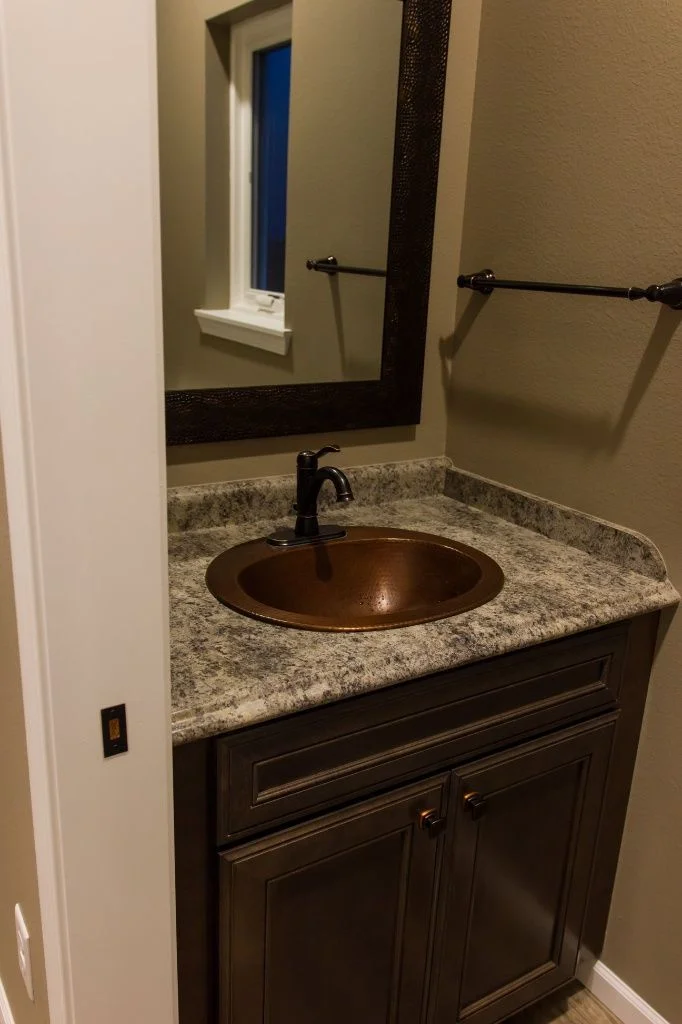 Anasazi Builders Custom Bathroom with Copper Sink and Granite Countertop.