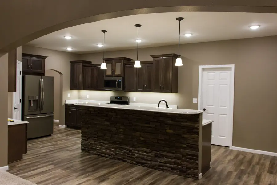 Anasazi Builders Custom Kitchen with Stone Breakfast Bar.