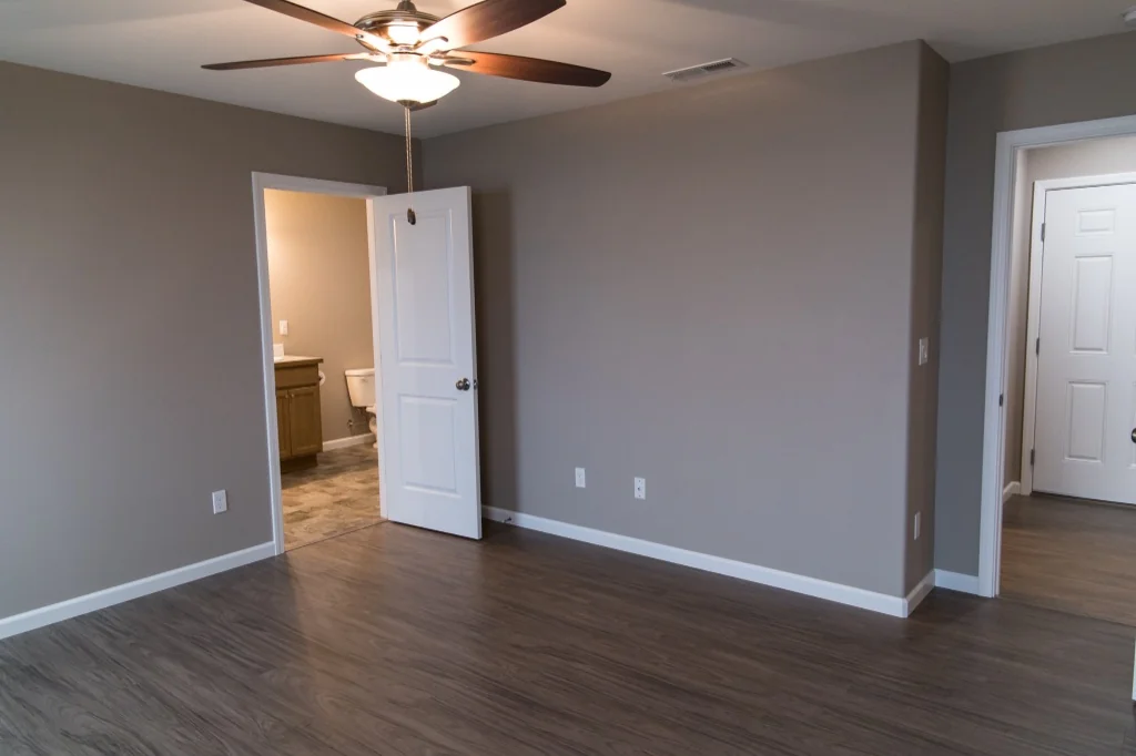 Anasazi Builders Master Bedroom with En-suite Bathroom and Modern Flooring.