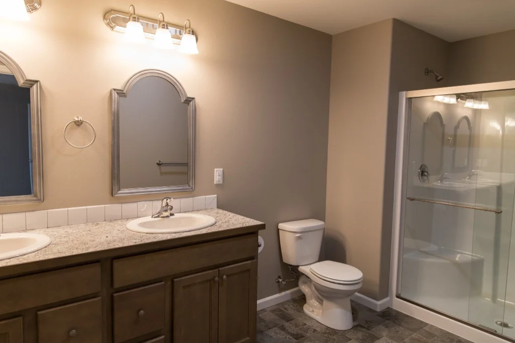 Anasazi Builders Modern Bathroom with Double Vanity and Glass Shower.