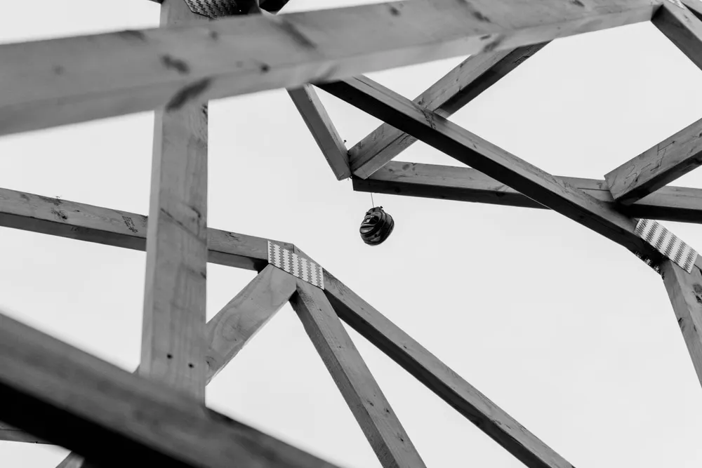 Structural wooden beams framing the porch of an Anasazi Builders custom home project in Tri-Cities