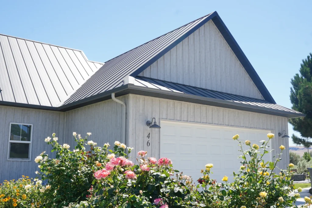 Finished custom home in Benton County with a metal roof and landscaped garden