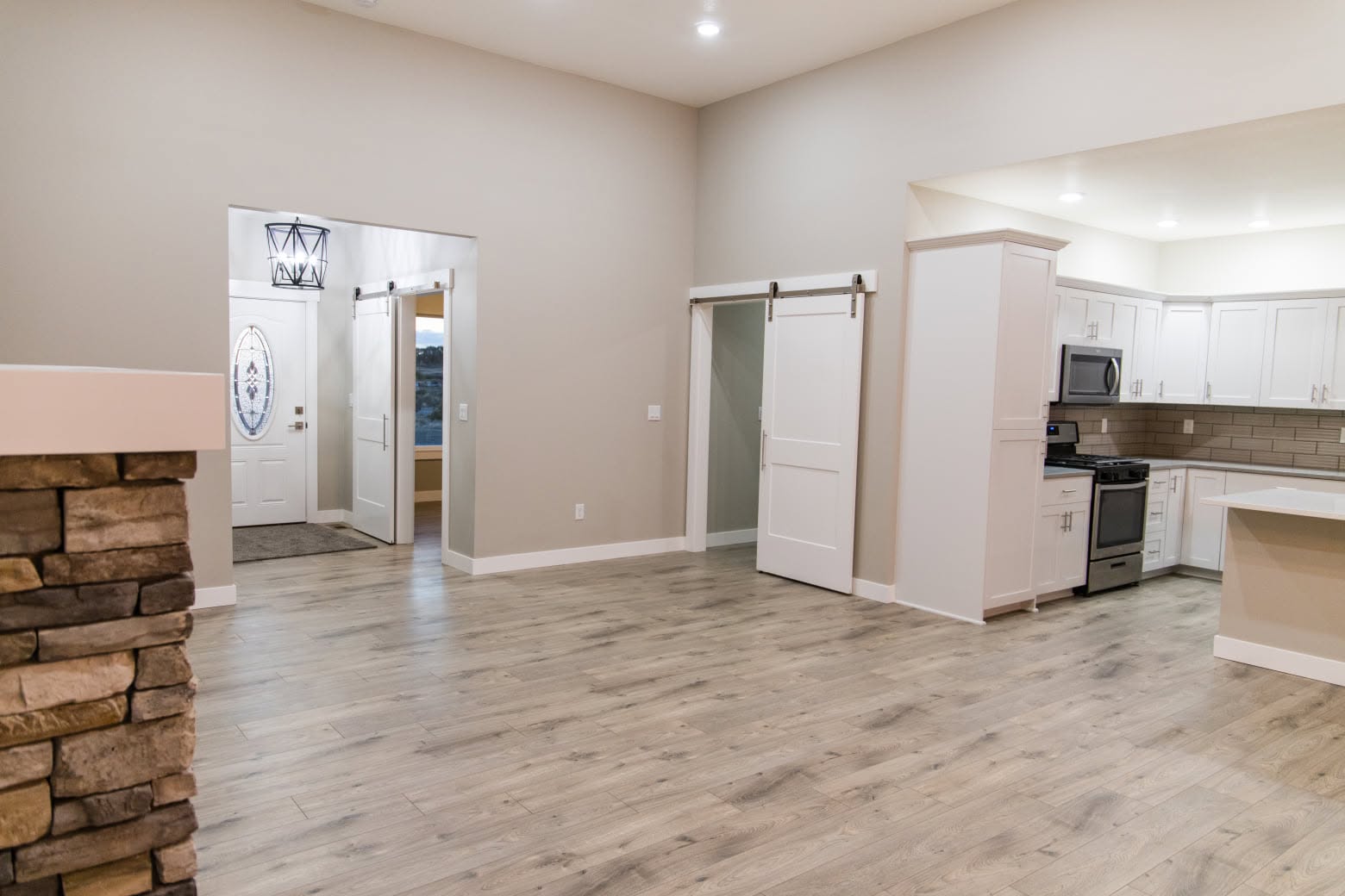 Wide view of the living and kitchen area