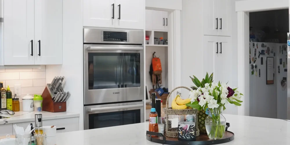 Completed white custom kitchen by Anasazi Builders representing a $400,000 home budget