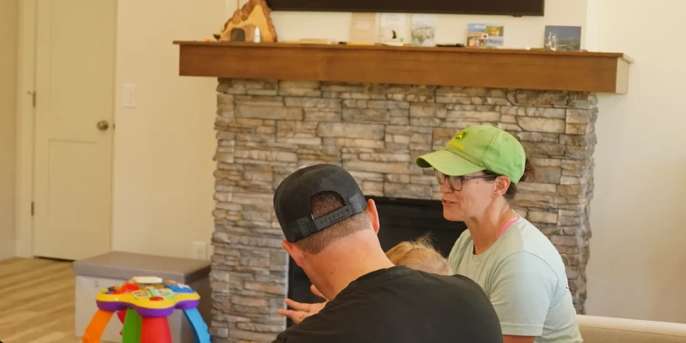Homeowners discussing priorities for a custom home project with a limited budget